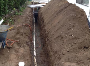 trench dug out for a Shoreline sewer replacement job